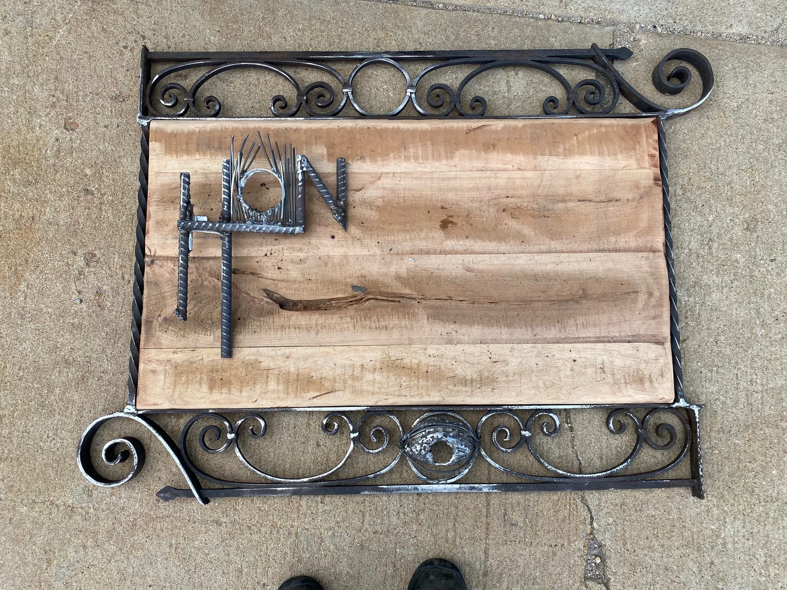 Completed PhiWorks metal-framed wood sign by Phi
