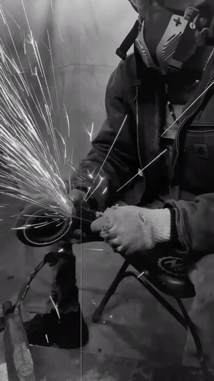 Animated preview of Phi grinding metal with sparks